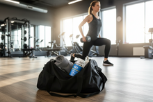 Load image into Gallery viewer, Bottle of 92+ Ashwagandha dietary supplement capsules with blue label promoting stress relief, energy, and overall balance